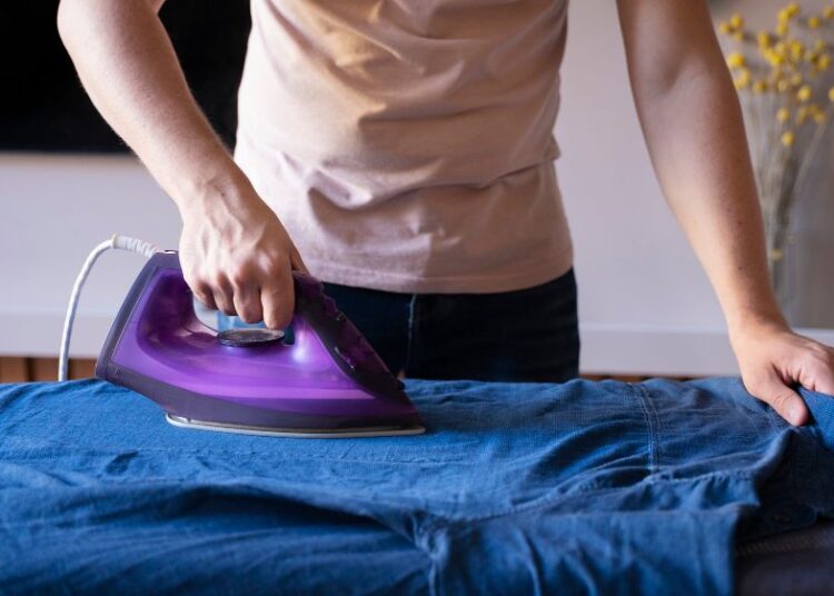 man doing steam Iron