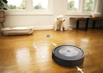 A robotic vacuum navigating through a modern living room, showcasing the efficiency of the iRobot Roomba j7 Robot Vacuum.