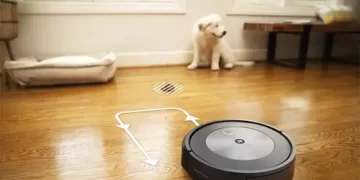 A robotic vacuum navigating through a modern living room, showcasing the efficiency of the iRobot Roomba j7 Robot Vacuum.