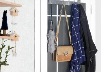 Over The Door Hook elegantly organizing towels and coats behind a door