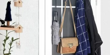Over The Door Hook elegantly organizing towels and coats behind a door