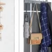 Over The Door Hook elegantly organizing towels and coats behind a door