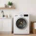 A clean, bright laundry room with a modern Bosch washing machine
