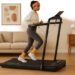 a lady using Home Treadmill in sitting room