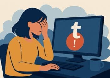 Illustration of a person sitting at a computer displaying a Tumblr error symbol, representing a Tumblr outage.