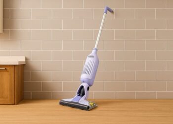 Shark VacMop 2‑in‑1 cordless vacuum spray mop standing against a kitchen wall