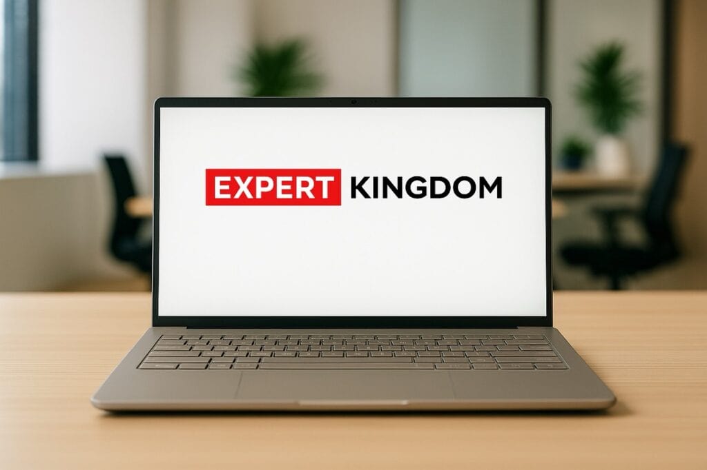 Asus Zenbook A14 laptop on an office desk displaying Expert Kingdom branding on screen