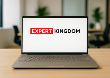 Asus Zenbook A14 laptop on an office desk displaying Expert Kingdom branding on screen