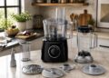 Bosch MultiTalent 3 food processor with blender jug, chopping blade, slicing discs and measuring accessories in a modern kitchen