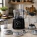 Bosch MultiTalent 3 food processor with blender jug, chopping blade, slicing discs and measuring accessories in a modern kitchen