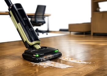 Tineco FLOOR ONE S7 Master wet and dry vacuum cleaner cleaning a spill on hard flooring in a modern office environment